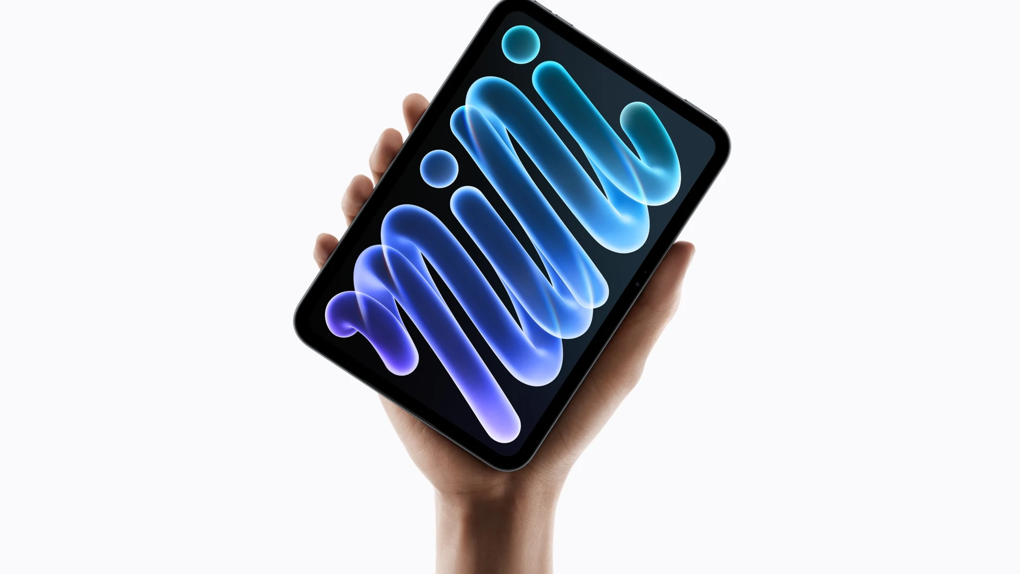 iPad mini con pantalla OLED sostenido en una mano, con el fondo de pantalla con la palabra mini, foto oficial de Apple